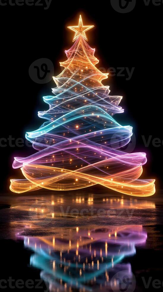 Colorful light trails create a glowing Christmas tree in a dark setting during the holiday season photo