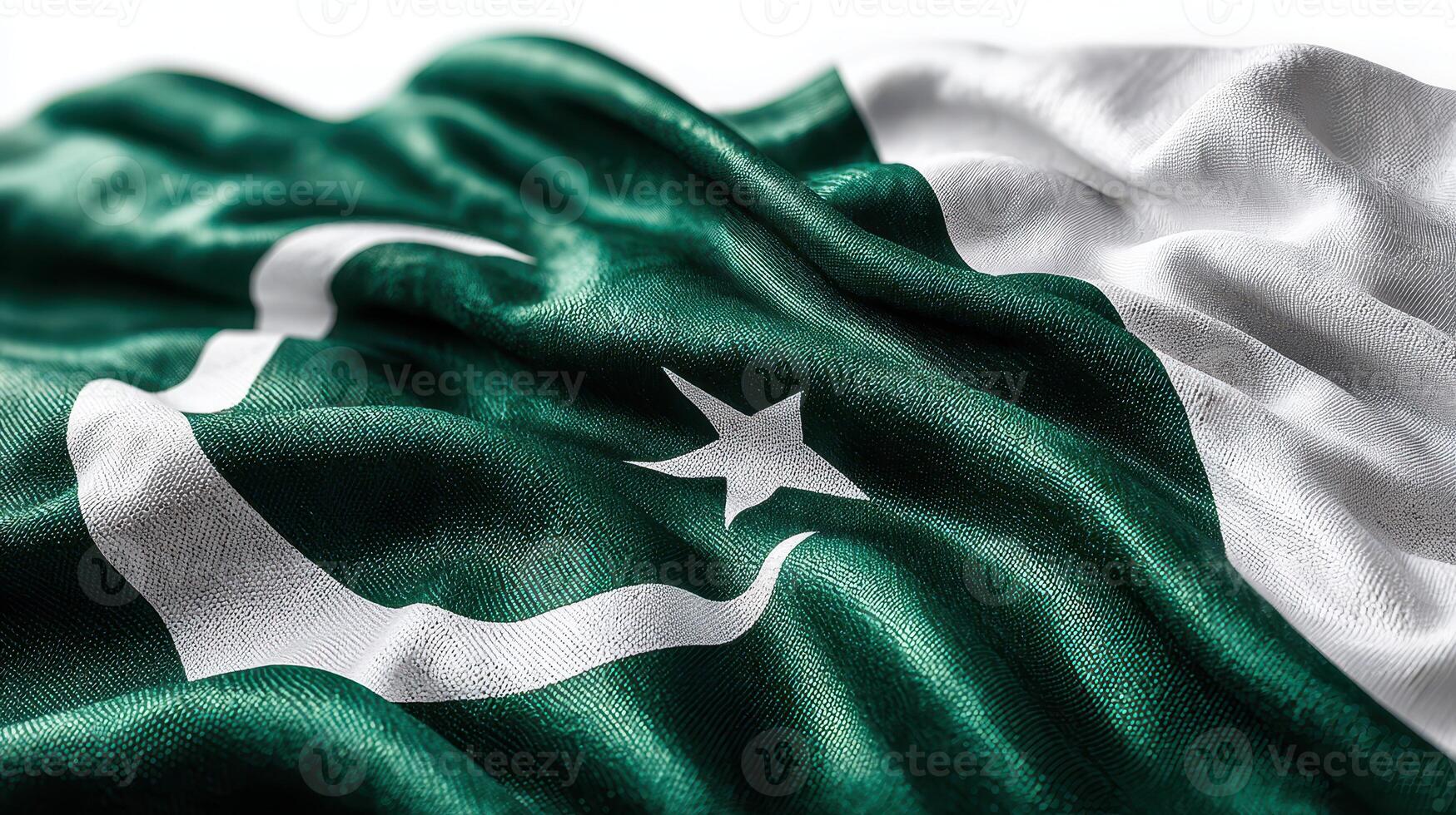 Vibrant Pakistani flag waving under bright sunlight, showcasing deep green fabric with white crescent and star emblem photo