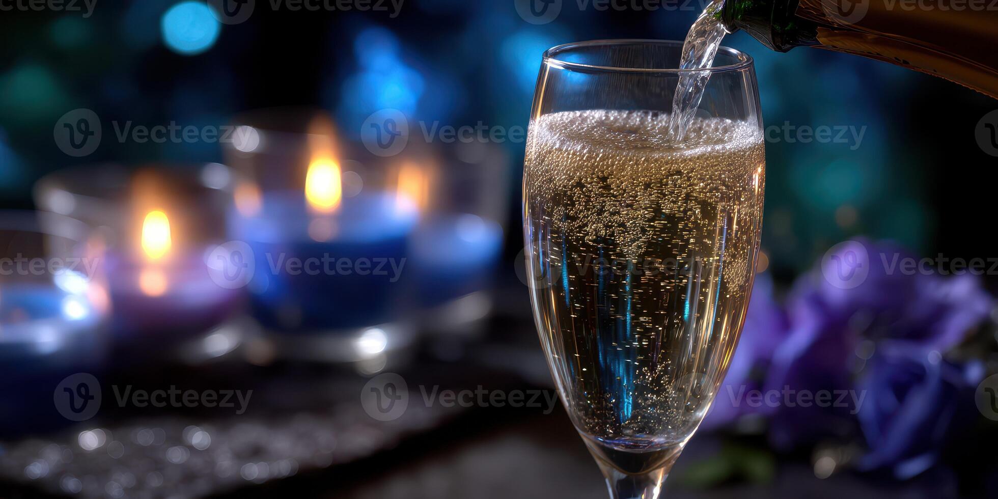 Bubbles rise in a champagne flute as golden liquid is poured amidst candlelight and vibrant flowers at a celebration photo