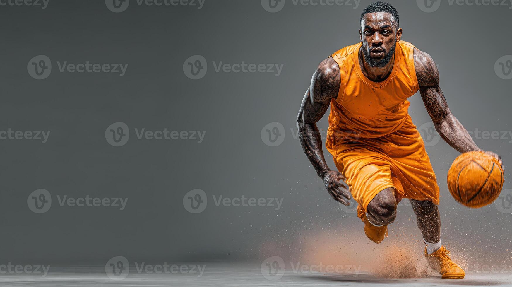 Dynamic basketball player dribbling down the court in an orange jersey during an intense game practice photo