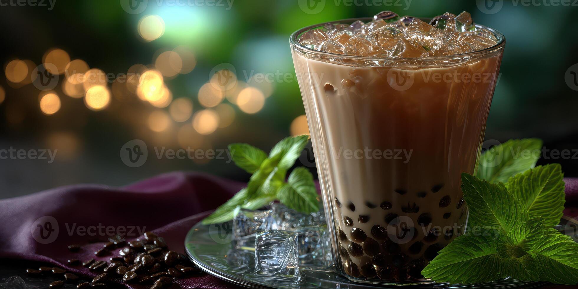 Beverage with tapioca pearls served in a glass filled with ice and mint leaves during a cozy evening gathering photo