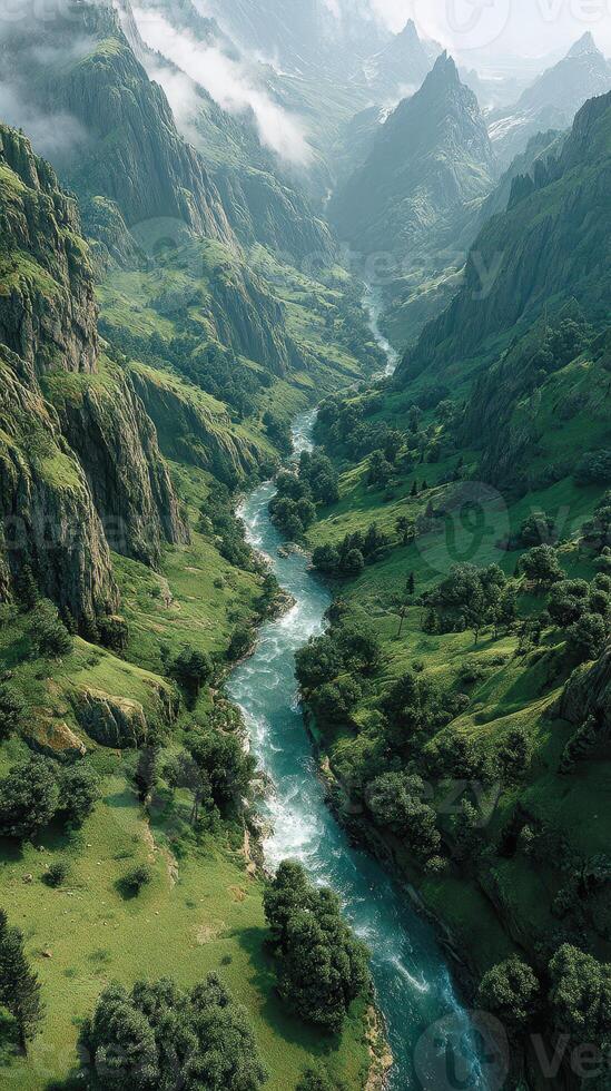 Majestic river flows through lush green valley under misty mountains in the early morning light photo
