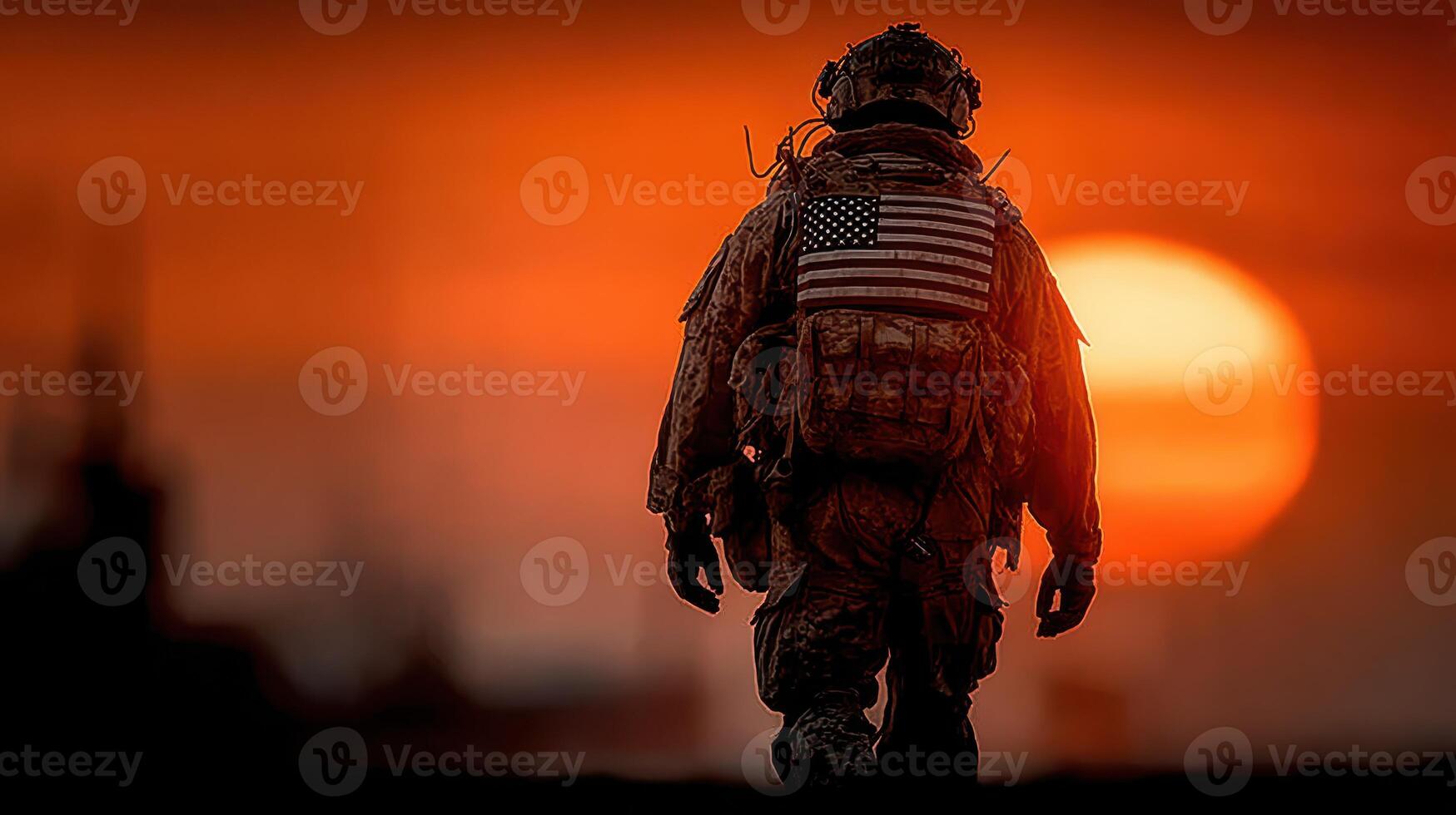 Soldier walking towards sunset with American flag in silhouette against a dramatic sky photo
