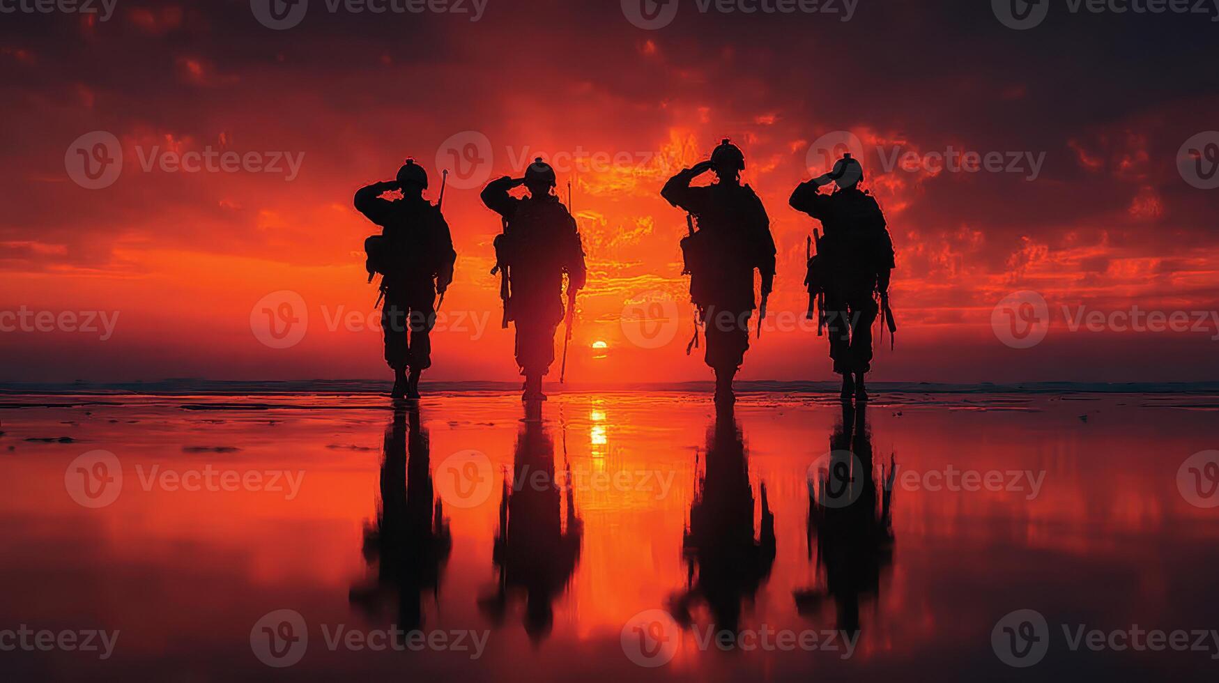 Soldiers saluting at sunset on a beach during a military ceremony photo