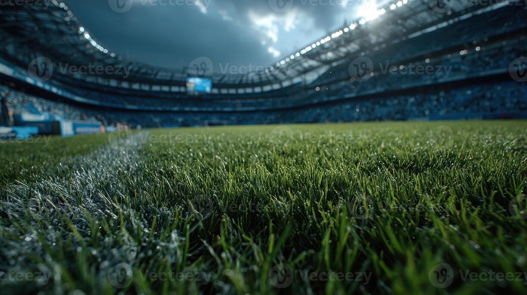 Vibrant green turf at a stadium under dramatic skies during a sporting event photo