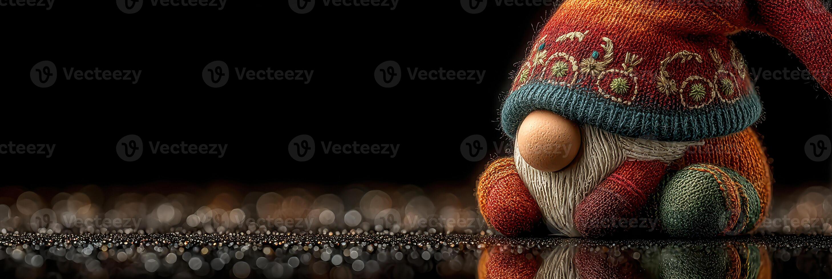 Decorative gnome figure resting on shiny surface with blurred lights in the background during the festive season photo
