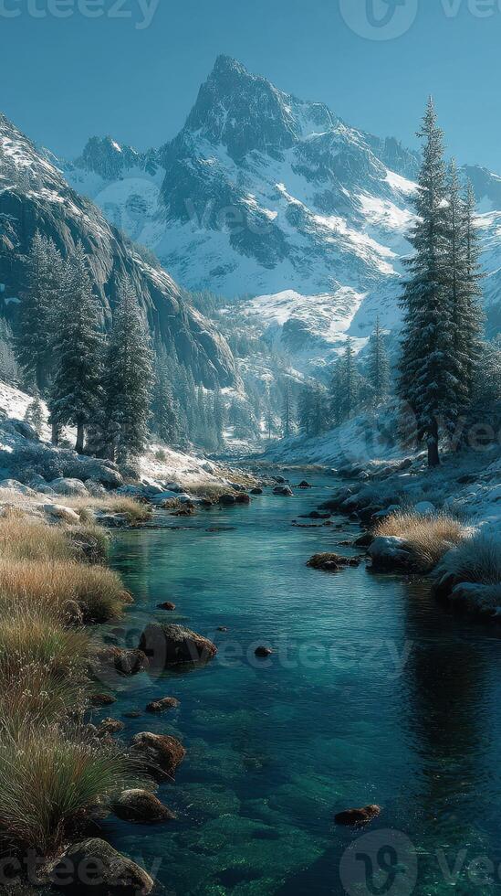 Snow-capped mountains rise majestically above a tranquil river surrounded by evergreen forests in a serene winter landscape photo