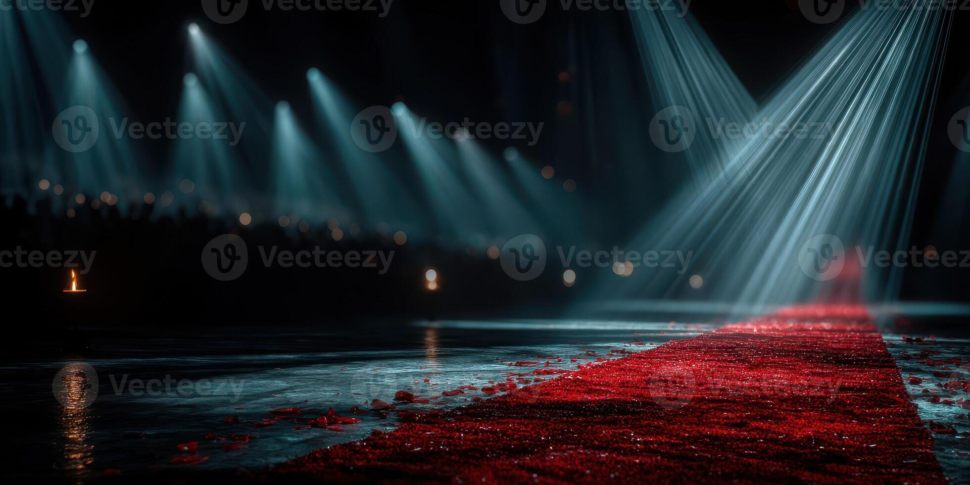 Fashion runway event at night featuring dramatic lighting and rose petals along the red carpet, creating an elegant atmosphere for models photo