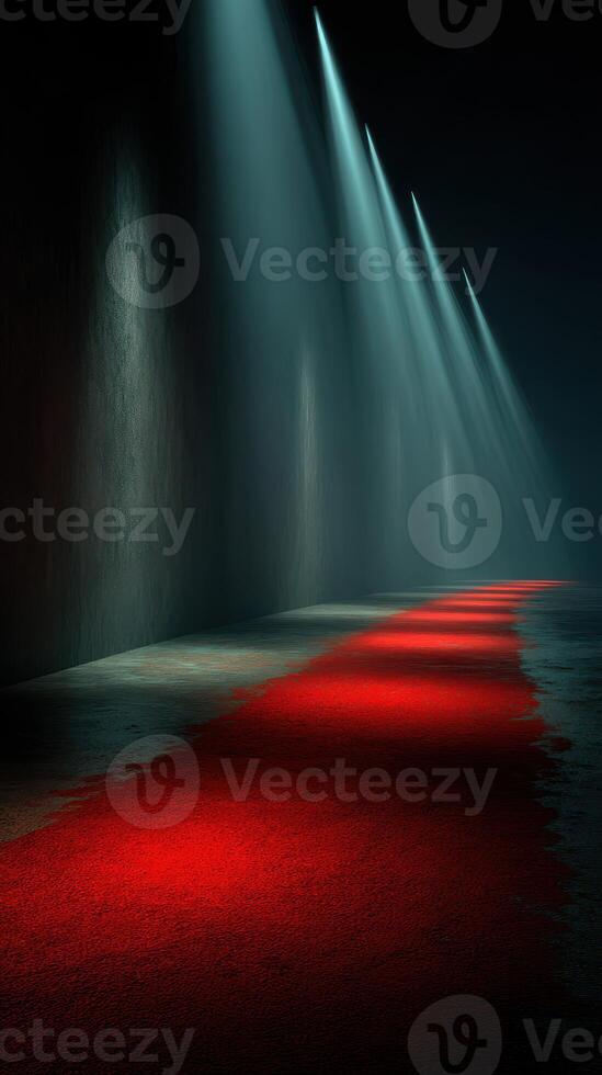 Glimmers of light illuminate a red carpet in a dimly lit corridor during an evening event setup photo