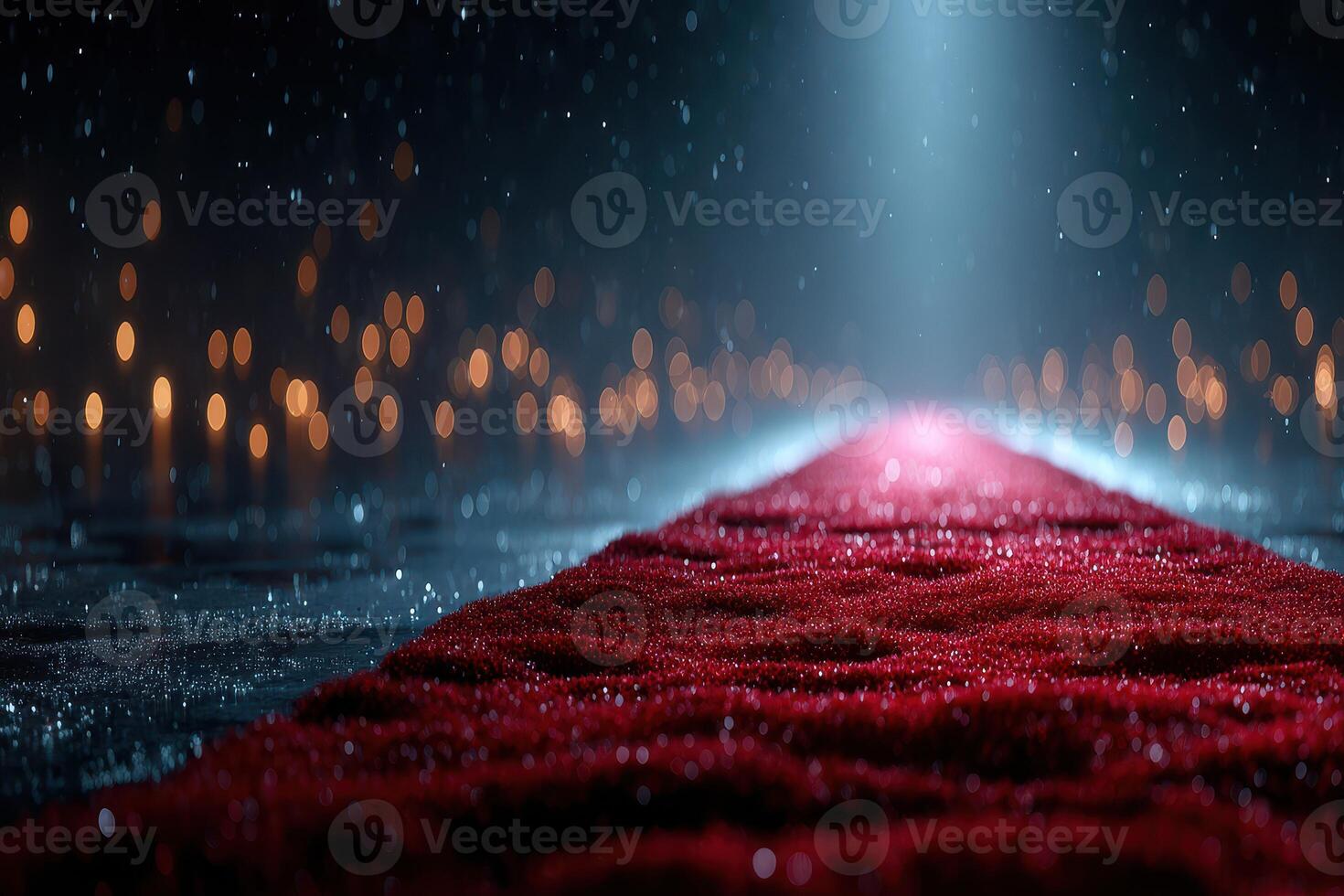 Red carpet leading into a spotlight with raindrops and blurred lights in a dramatic setting during a nighttime event photo