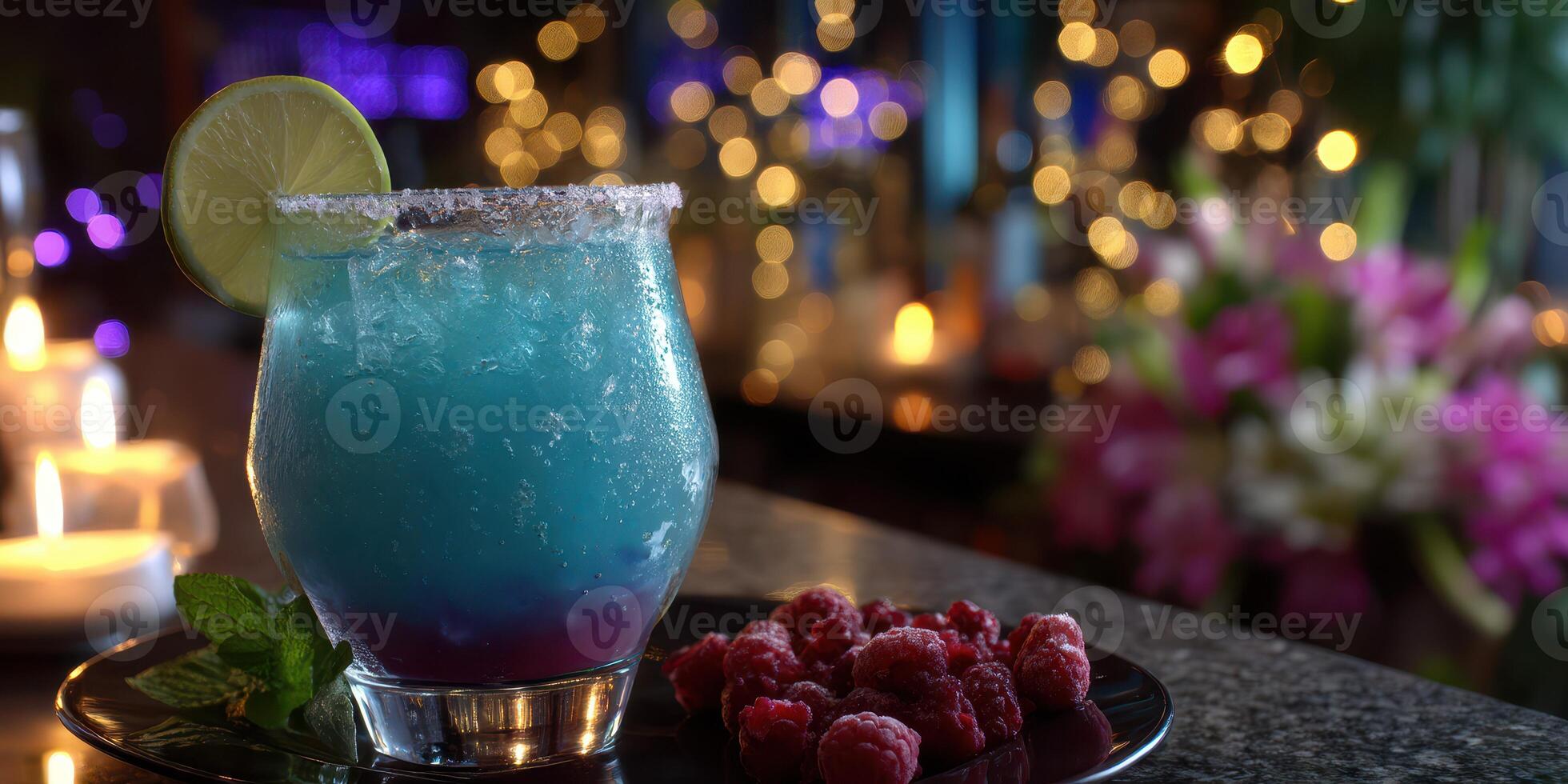 Refreshing blue cocktail with garnishes served in a dimly lit bar with ambient lighting and decorative flowers photo