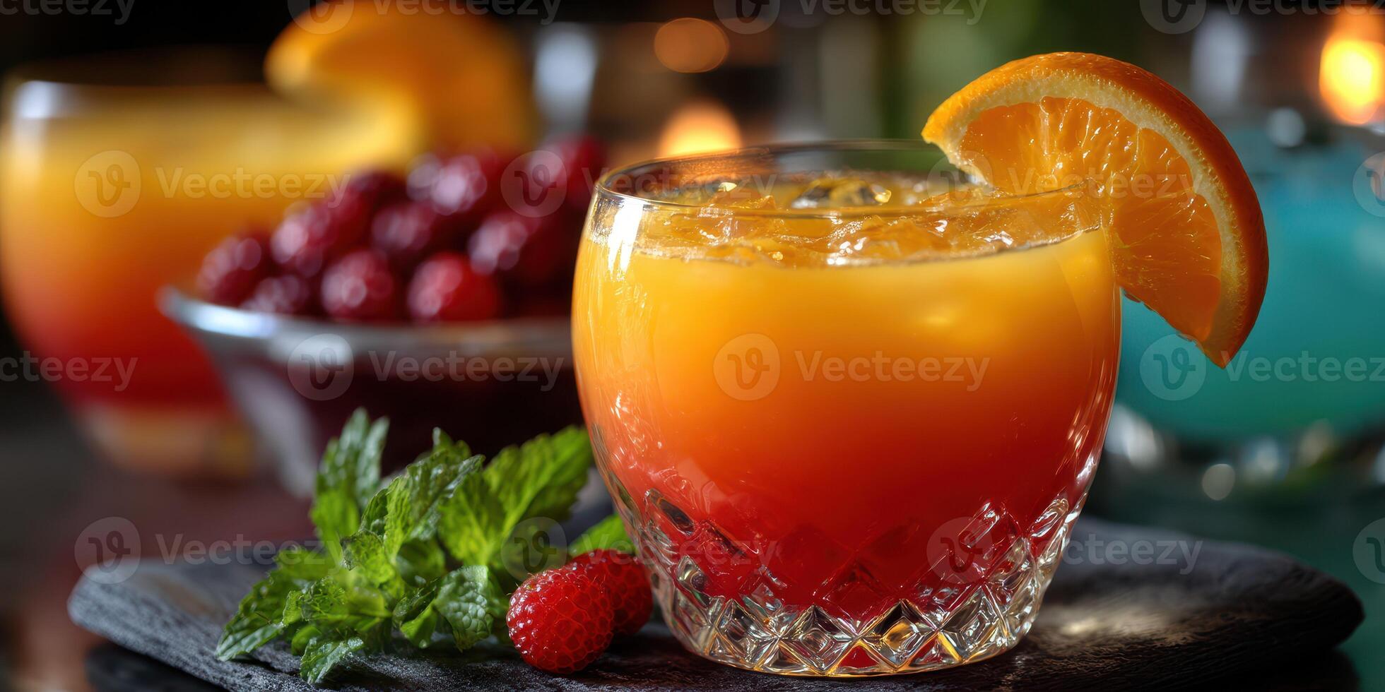 Refreshing cocktail served in a crystal glass with vibrant colors and garnished with orange slice photo