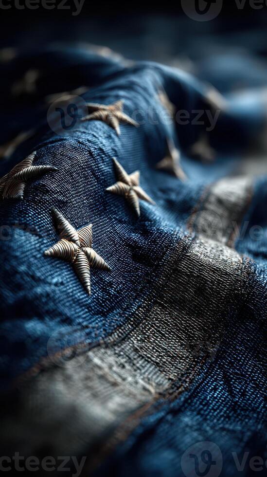 Detailed close-up view of an intricately embroidered flag with stars and stripes photo