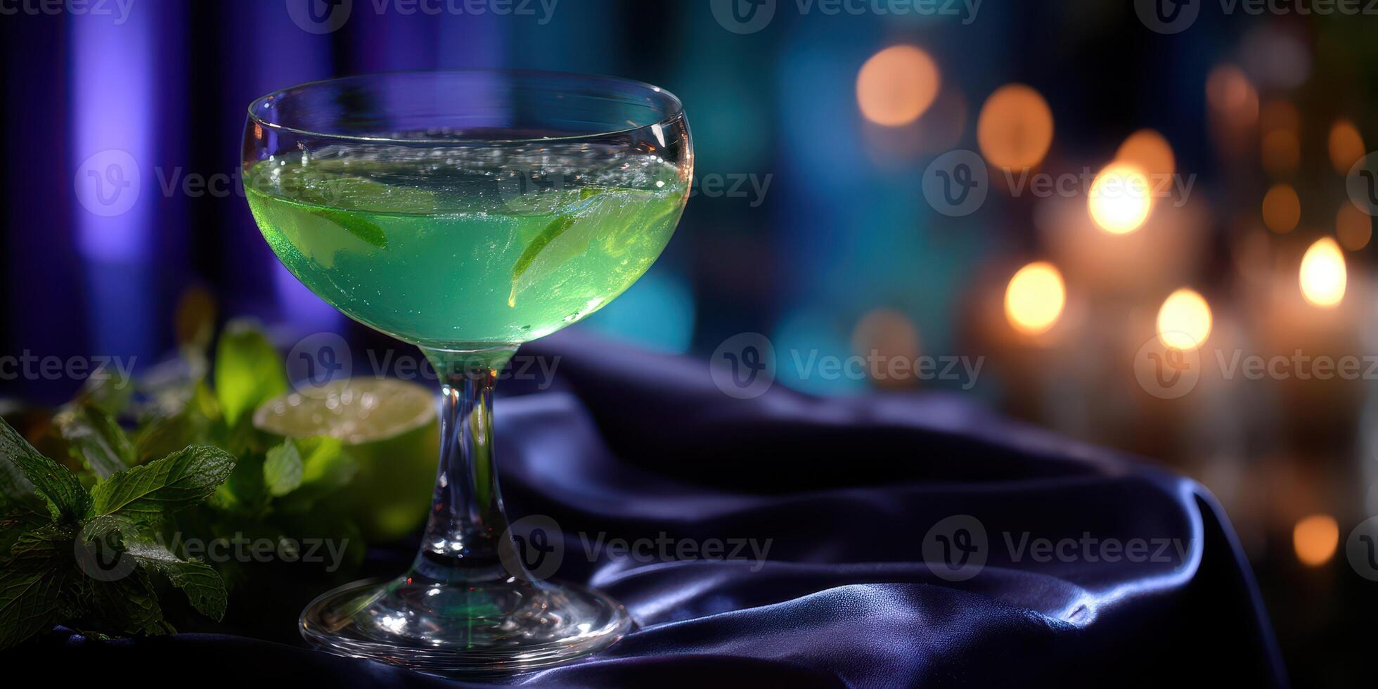 Refreshing green cocktail served in an elegant glass during a stylish evening gathering photo