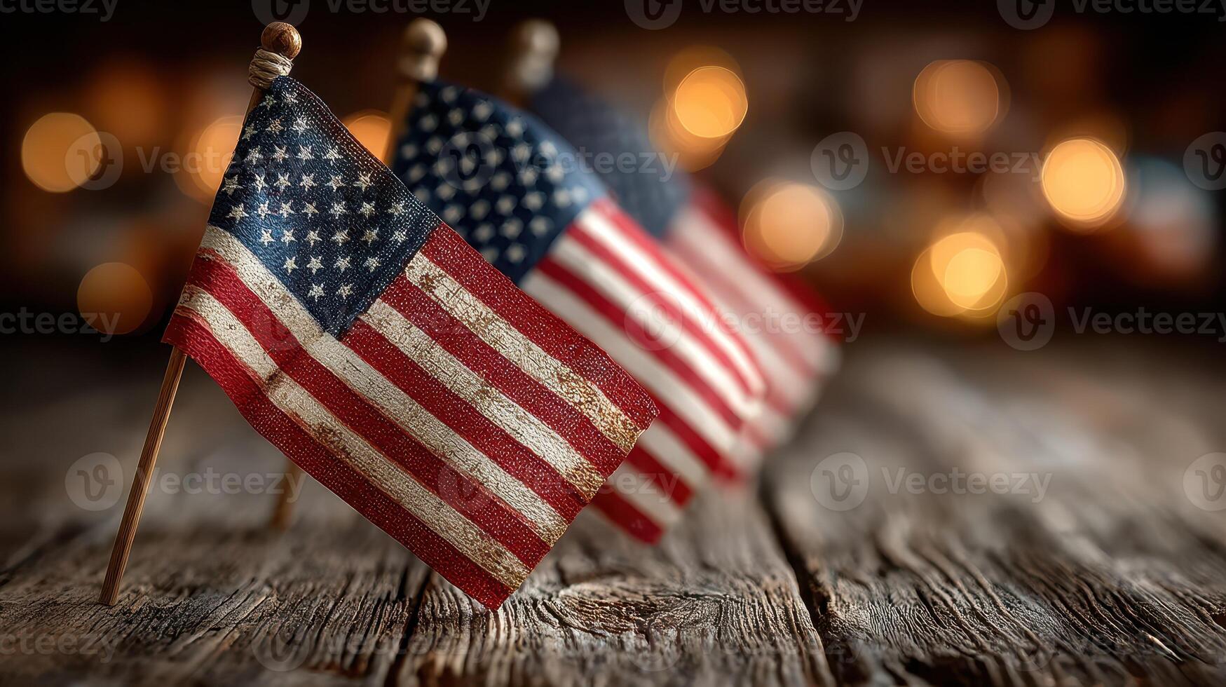 Small American flags on wooden table with warm bokeh background, perfect for patriotic celebrations and events photo
