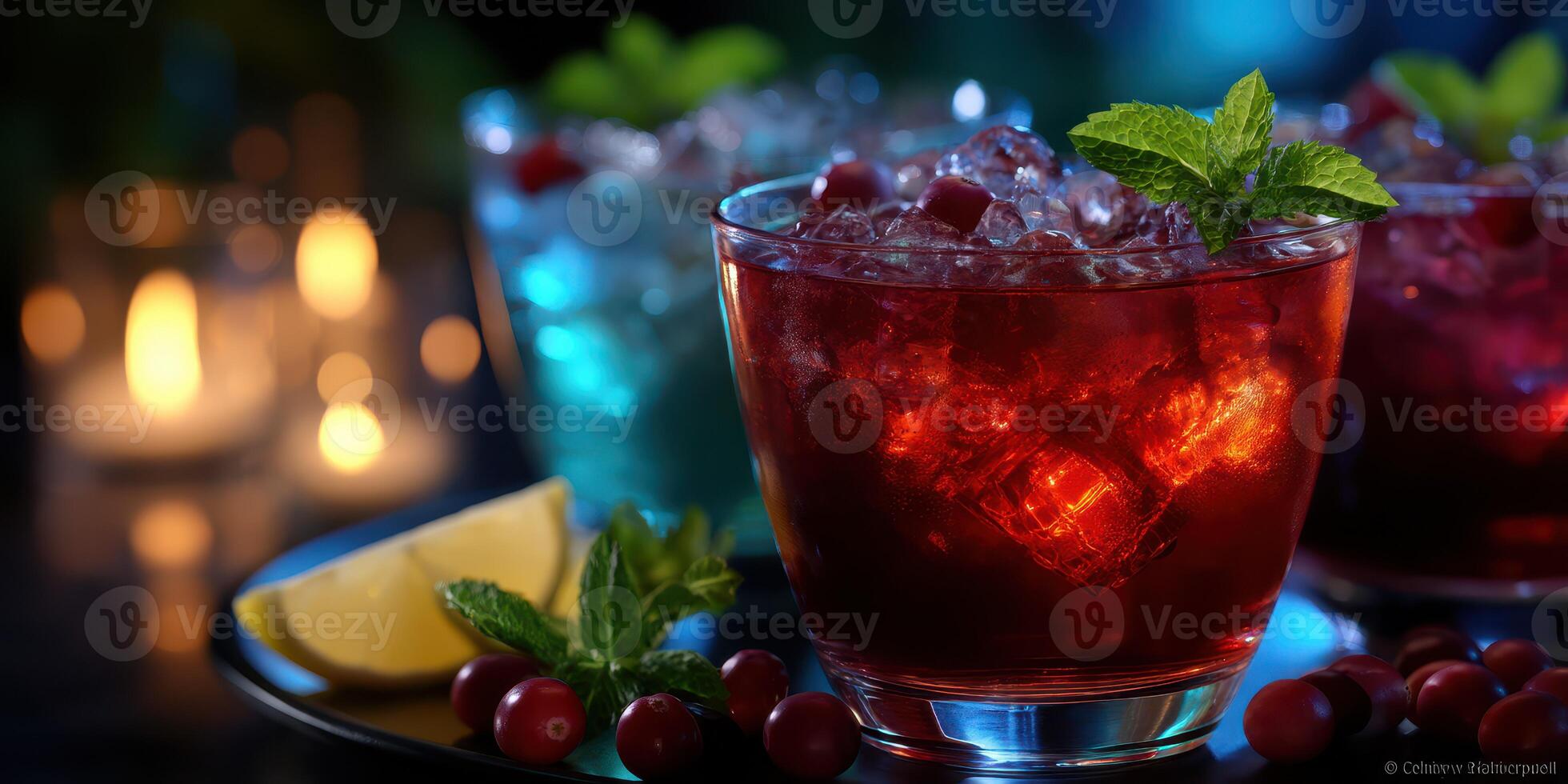 Colorful cocktails served with fresh mint and citrus garnish in a dimly lit setting photo