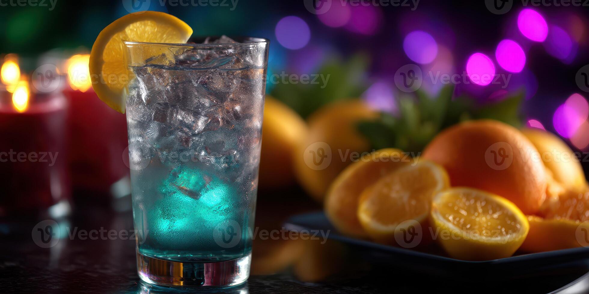 Refreshing cocktail served over ice with citrus fruits and colorful lights in the background at a social gathering photo