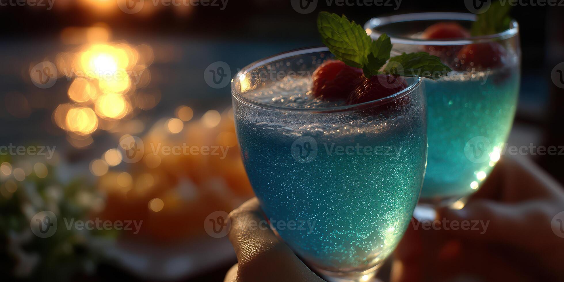 Refreshing blue cocktails in elegant glasses during a sunset gathering by the poolside photo
