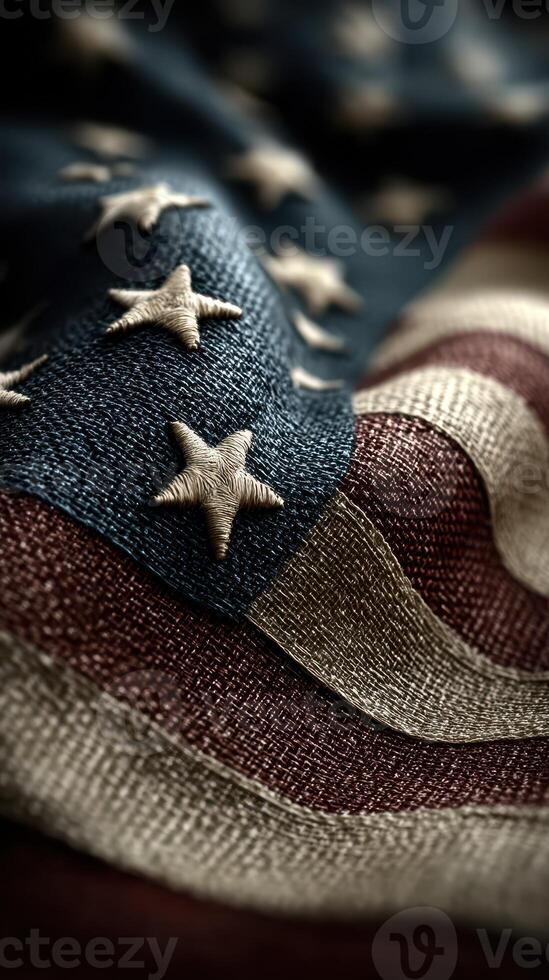 Close-up view of an American flag showcasing detailed stitching and fabric texture in warm natural light photo