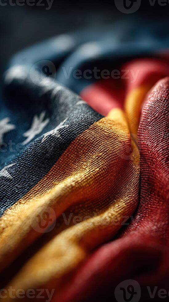 Close-up view of textured fabric showcasing vibrant colors of a flag during a soft light setting photo