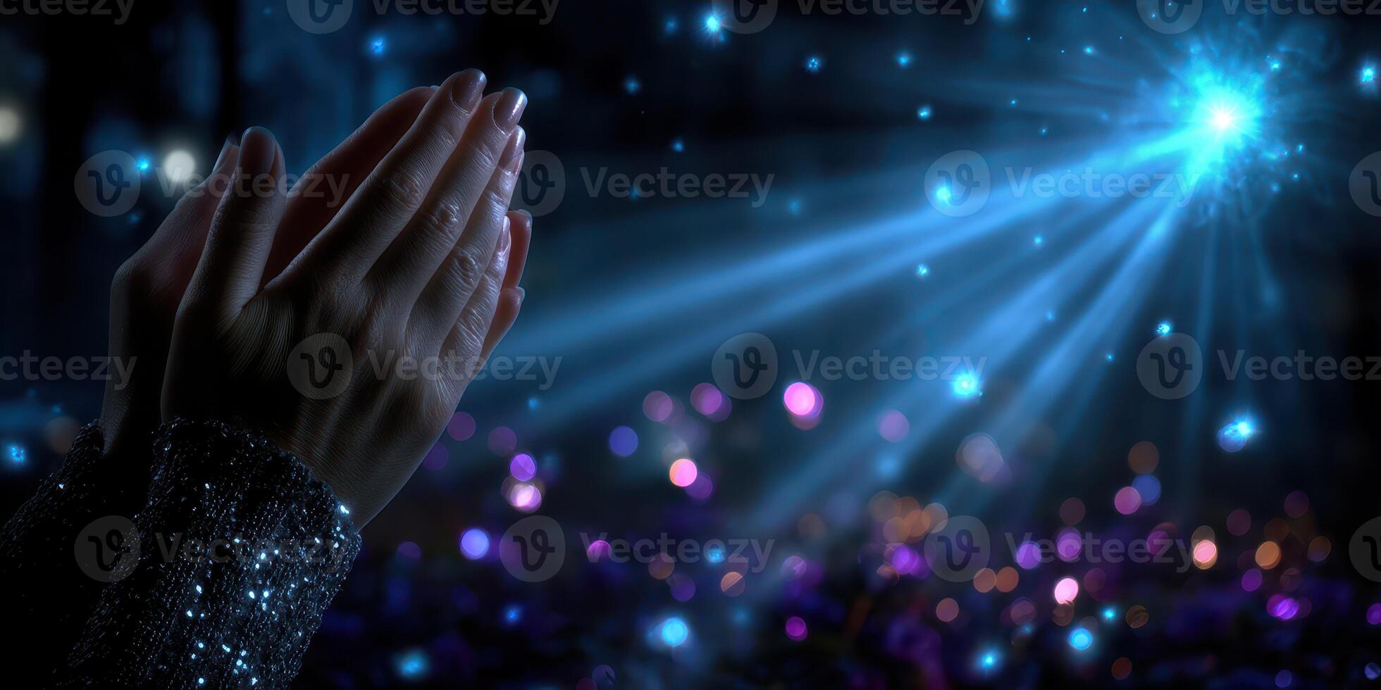 Hands lifted in appreciation during a captivating light display at a nighttime gathering, showcasing vibrant colors and glowing effects photo