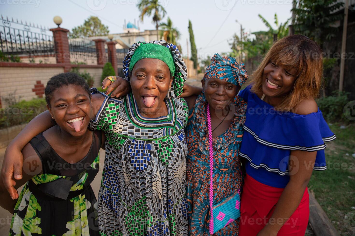 Four african women of different ages together laugh and make funny faces. photo