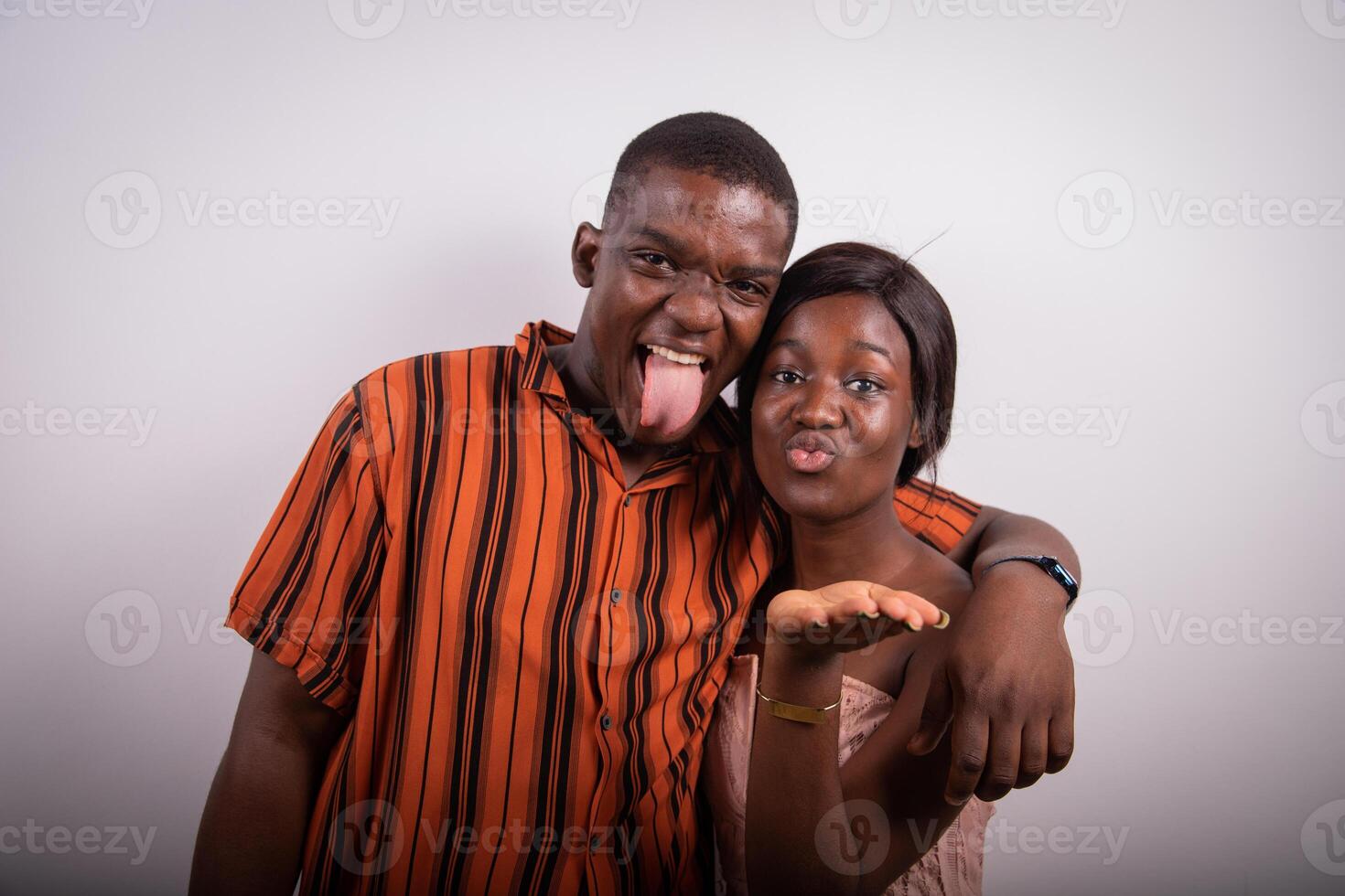 Young couple of friends embraced, having fun in the photo studio. Friendship concept