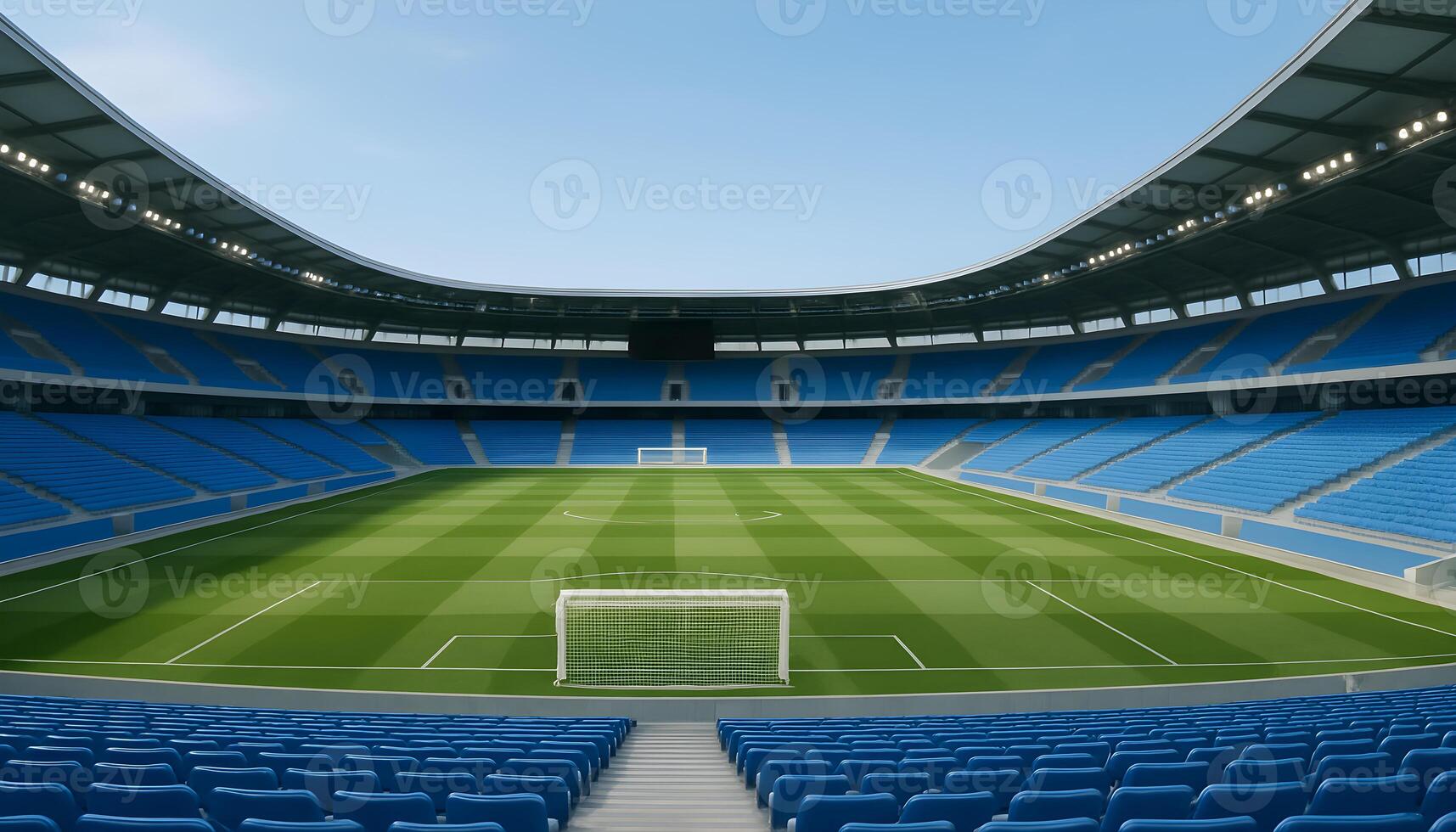 Grand empty football stadium with symmetrical green field and curved roof under bright blue sky photo