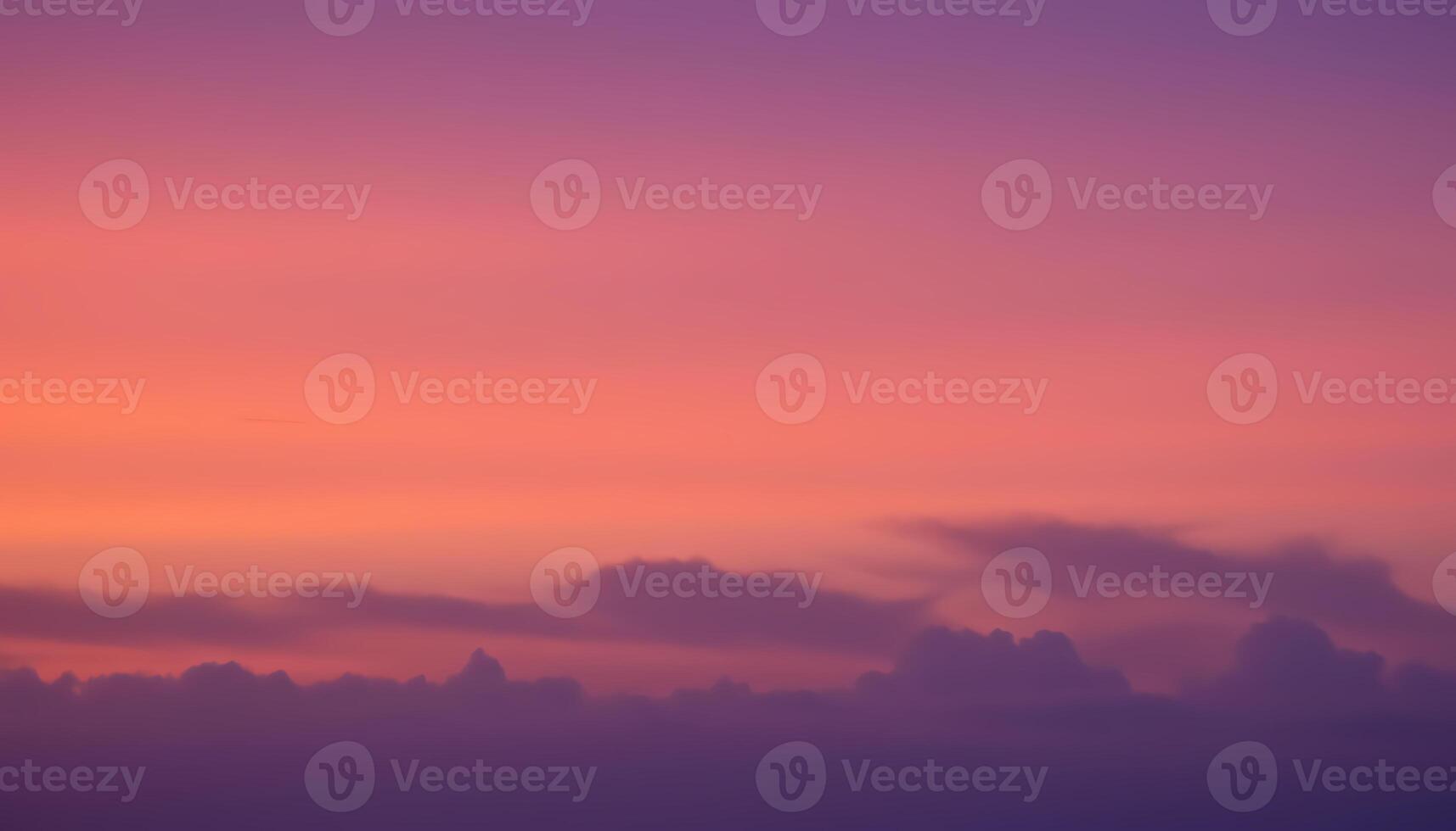 Elegant sunset gradient sky with smooth transitions blending deep purple pink and warm orange photo