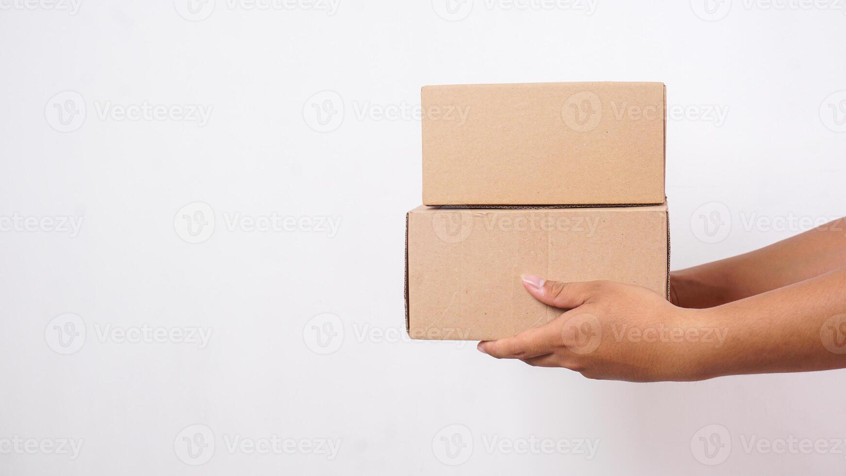 Hand of delivery man in delivering package boxes parcel isolated on white background photo