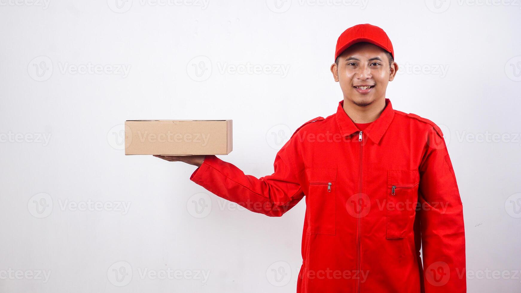 Asian Delivery man in red uniform with package box parcel isolated on white background photo