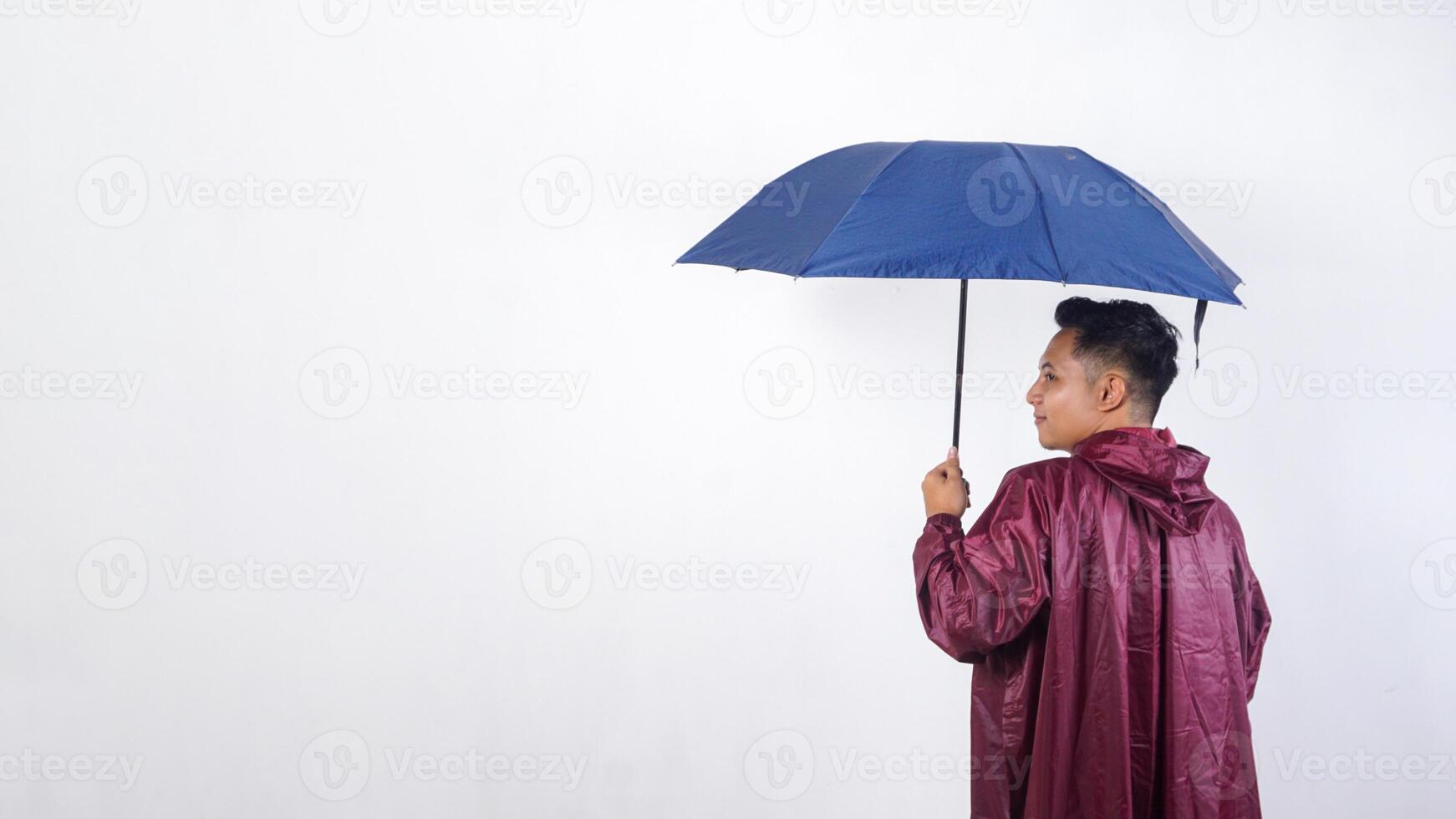 Asian man in red raincoat with umbrella isolated on white background photo