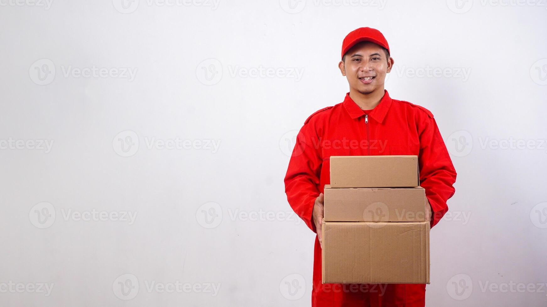 Asian Delivery man in red uniform with package boxes parcel isolated on white background photo