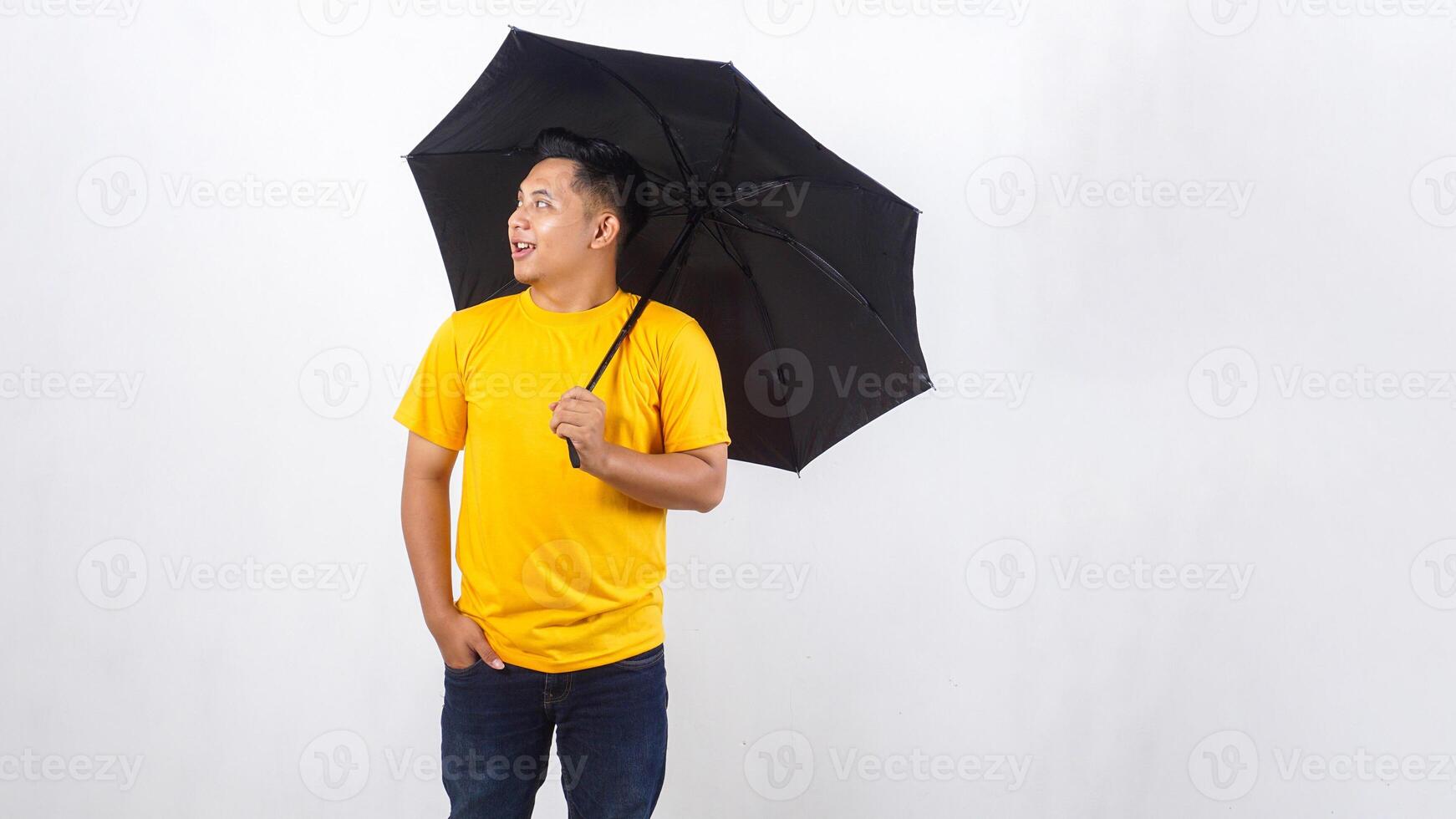 Asian man holds an umbrella isolated on white background photo