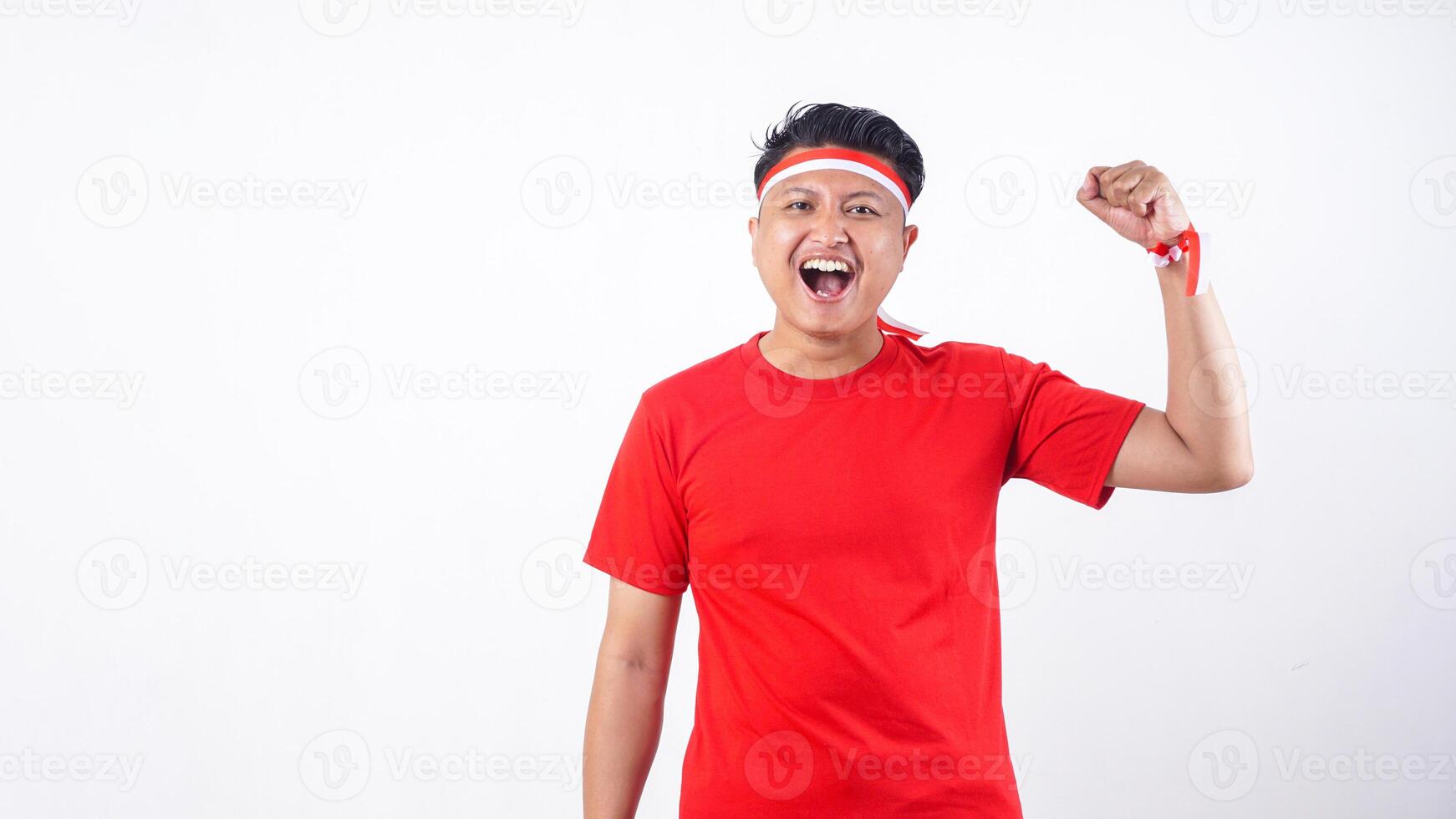 Happy Indonesian citizen with red and white ribbon wristband celebrate 17th of August independence day of Indonesia isolated on white background photo