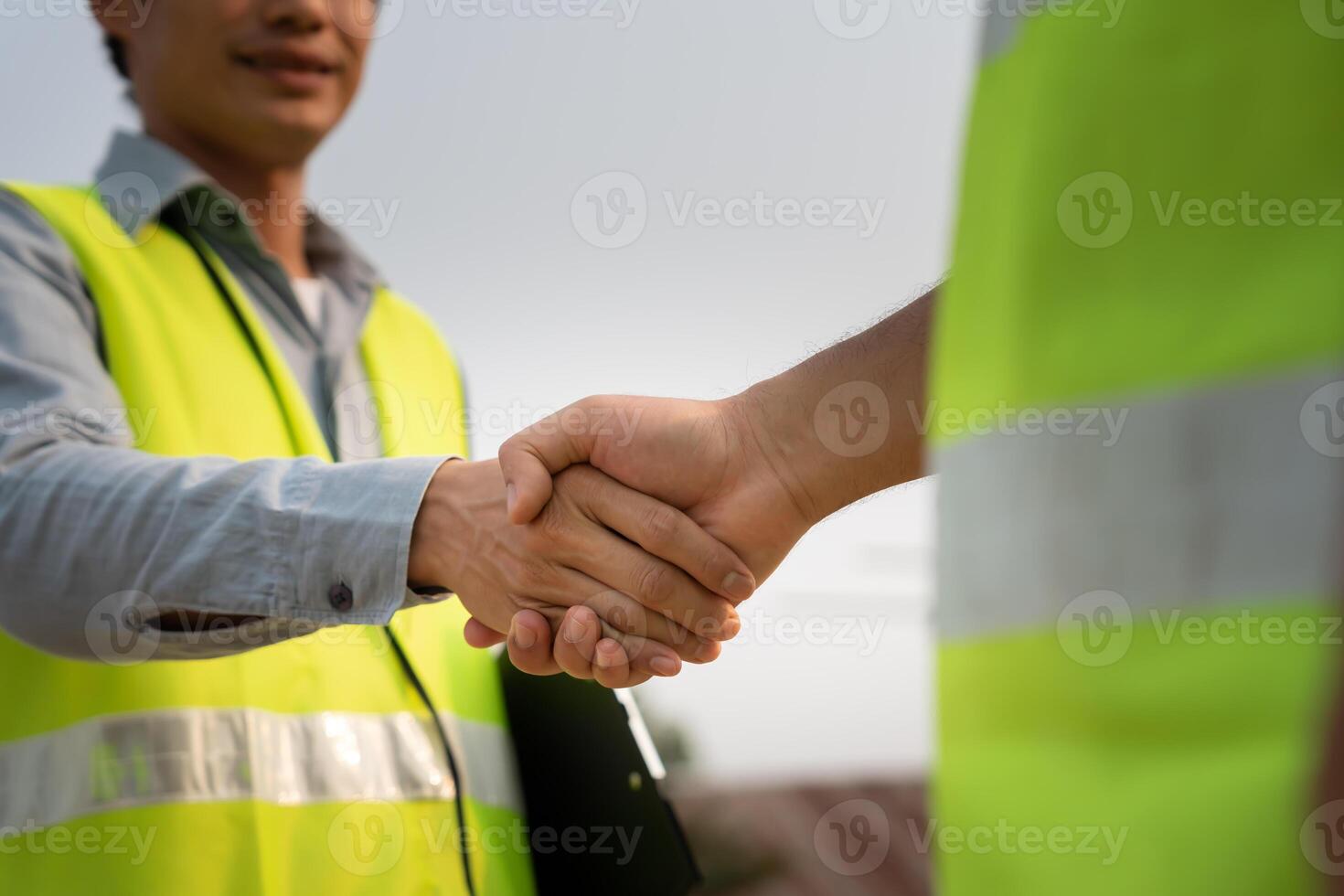 Construction team hands shaking greeting start up plan new project contract in office center at construction site, industry ,architecture, partner, teamwork, agreement, contacts. photo