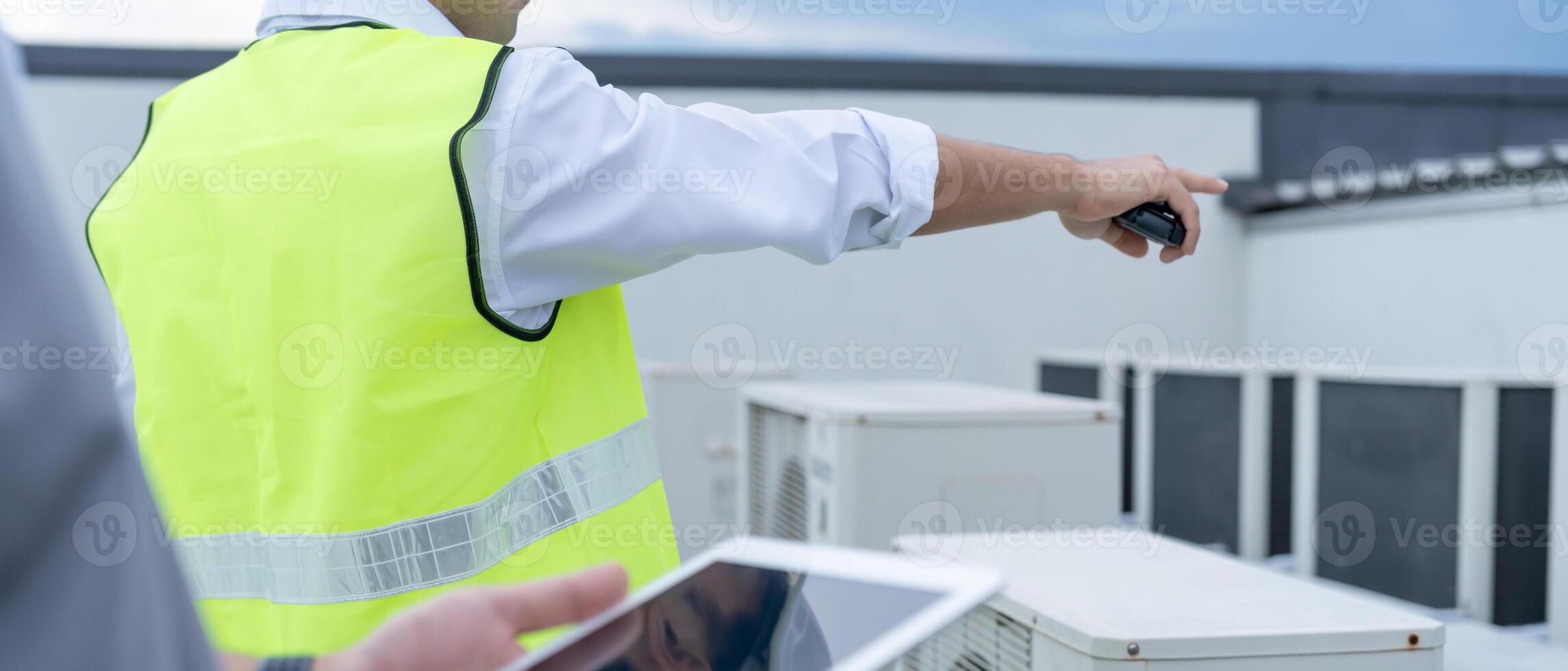 team use tablet check air condition systems on site. Contractor and inspector inspection construction during project.civil Forman check quality assurance. Audit, inspect, quality control. photo