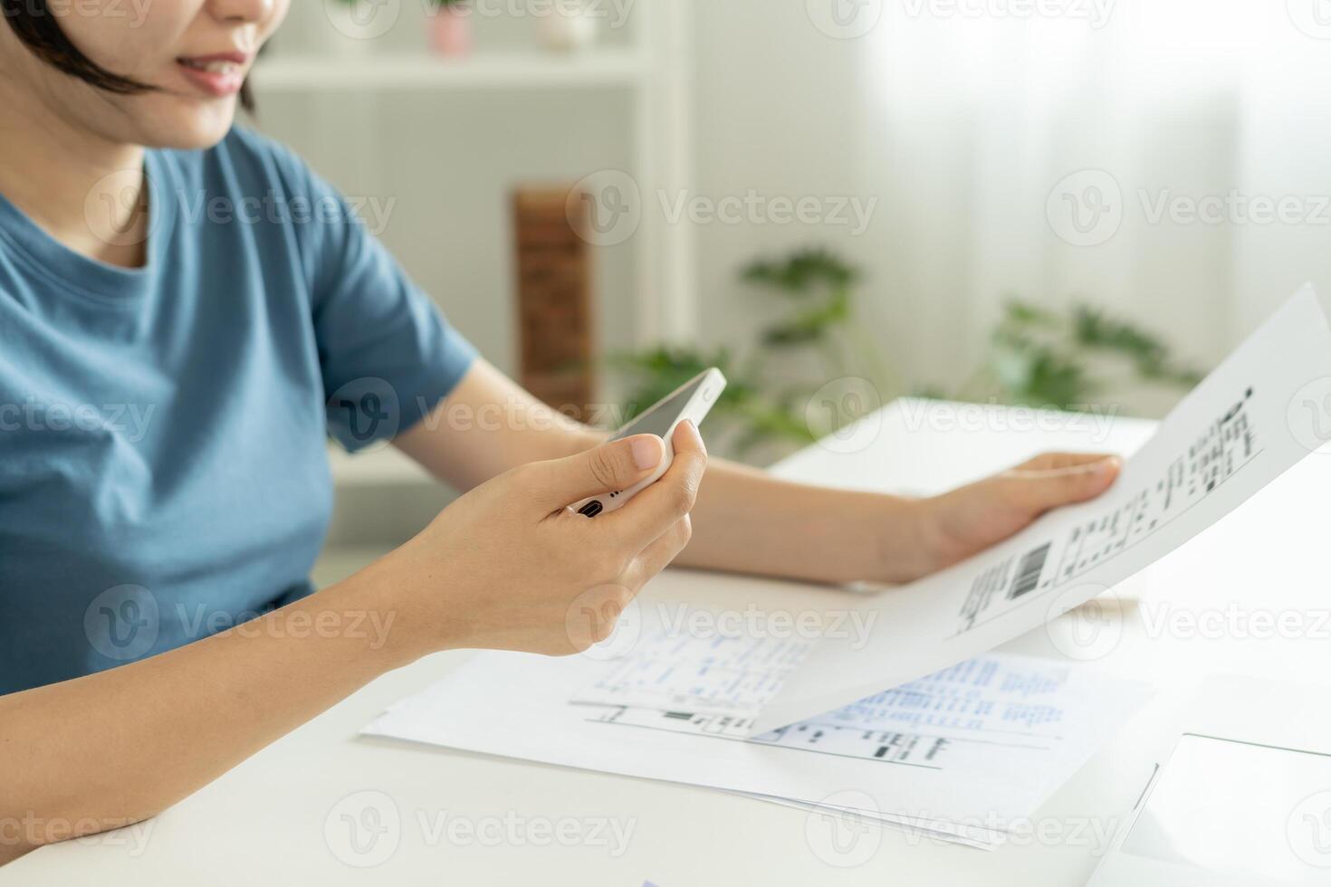 use phone scan barcode or QR codes to pay credit card bill after receiving document invoice. payment, receive, paying electricity, digital payments, technology, scanning photo