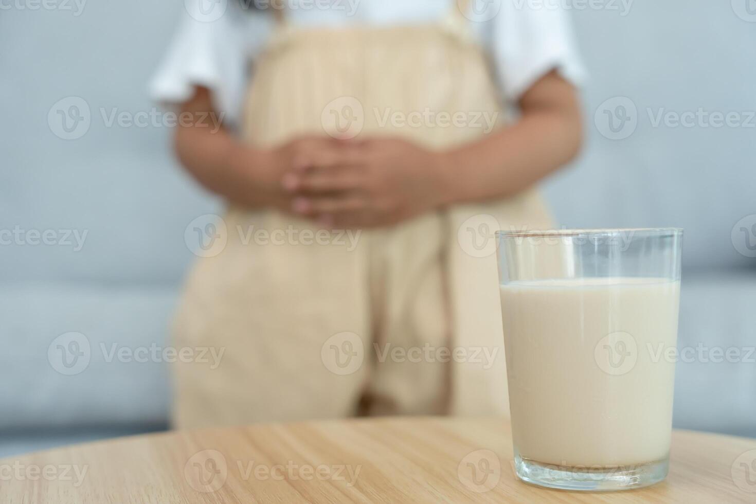 Milk allergen, children felling stomachache and diarrhea , runny stuffy sore nose suffer from intolerance allergy trigger symptoms. abdominal pain nut protein, rash, death, food allergy photo