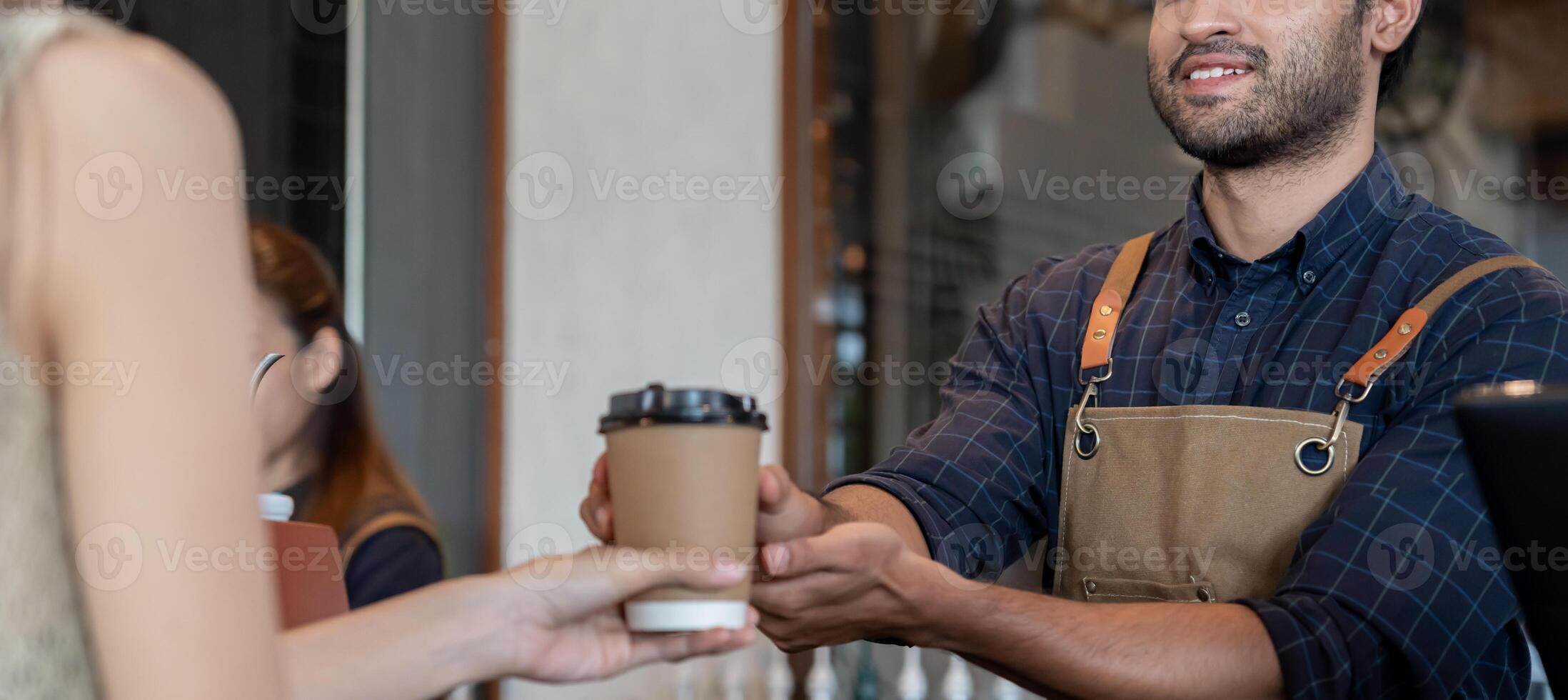 owner happy the pass on coffee in first day of small business cafe. guarantees safety, cleanliness, open the coffee shop. New normal. SME, welcome, restaurant, home made photo