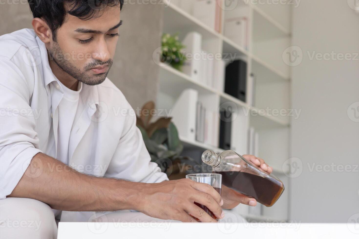 man addicted feeling bad drinking whiskey alone at home, stressed frustrated lonely drinking alcohol suffers from problematic liquor, alcoholism, life and family problems photo