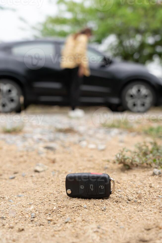 Lost car key on the ground, Car keys dropped on the floor or fall lying on the street home front. Walking Away From Lost Car Key, can not transport, express, rush time, wast time, emergency photo