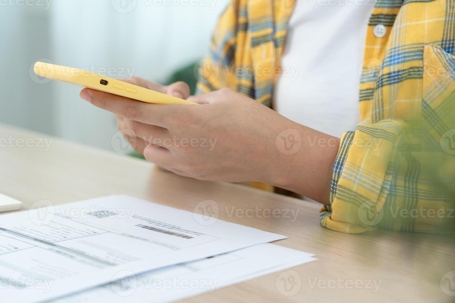 use phone scan barcode or QR codes to pay credit card bill after receiving document invoice. payment, receive, paying electricity, digital payments, technology, scanning, financial transaction photo
