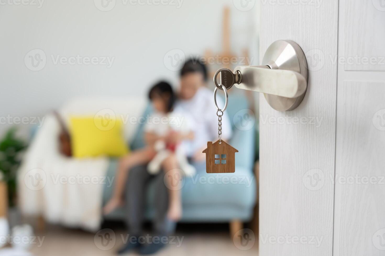 Moving house relocation. Open the door found Family smile and play on new house, inside the room was a cardboard box contain personal belongings and furniture. move in the new apartment or home. photo