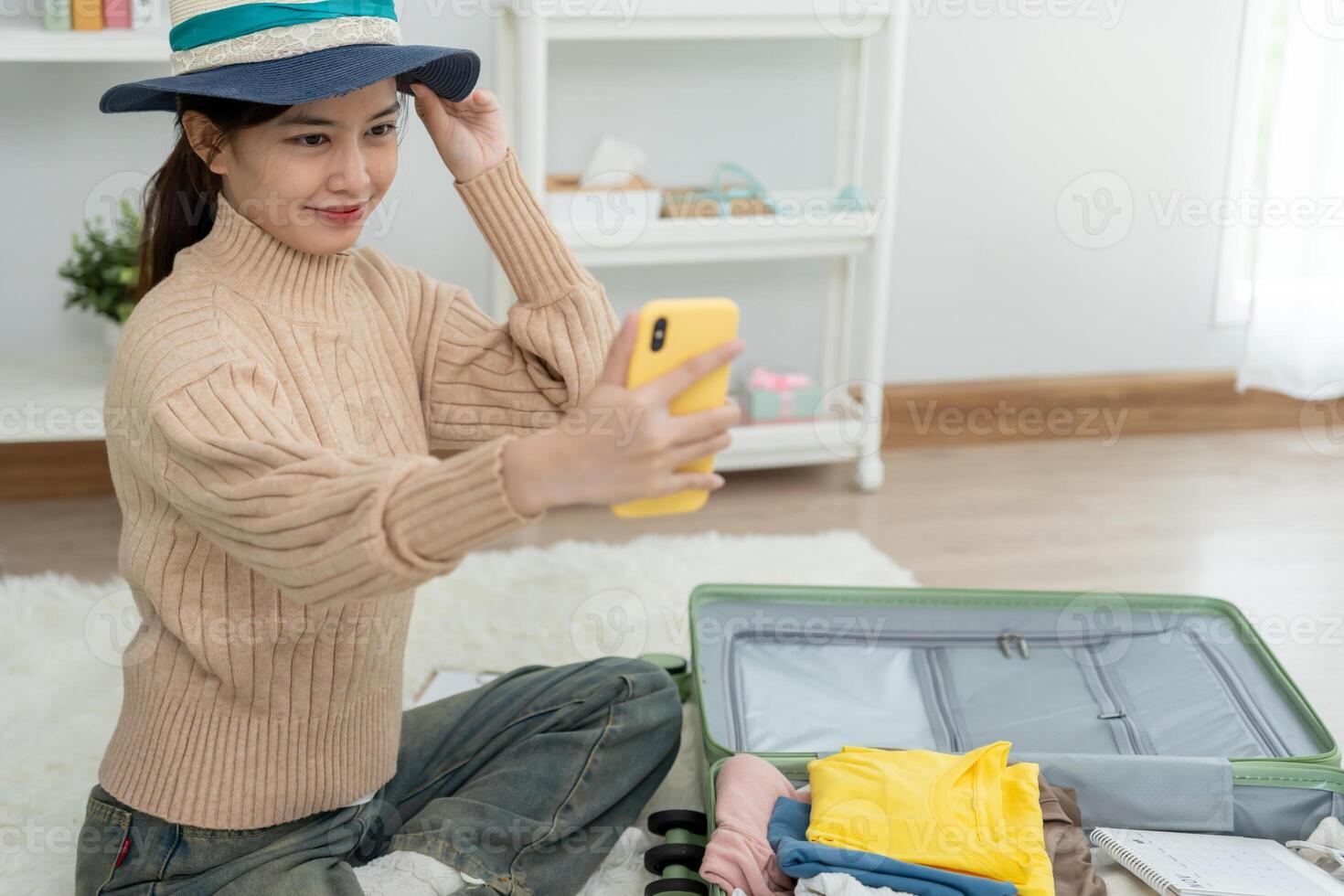 Portrait asian beautiful girl selfie and feel relax during bag pack. Pack your luggage before travel, Travel, life style, around the world. Advertisement photo