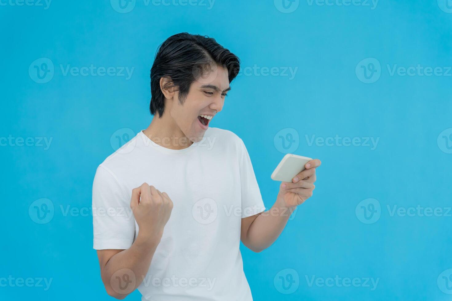 excited young man play games by mobile phone make winner gesture. female winning mobile gambling. Wow face expression. Esport streaming game online, surprise, gamer, online, earning, new generation. photo