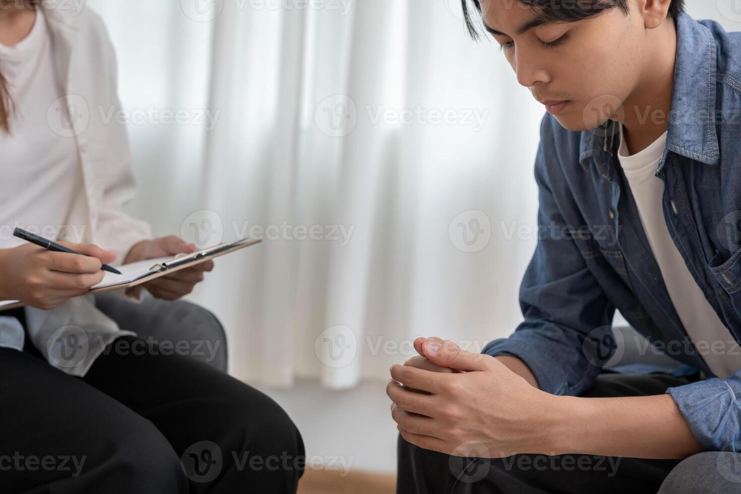 man hold hand fell sad from health problems. psychiatrist is recording the patient's condition for treatment. encouragement, love and family problem, bipolar , depression patient, protect suicide photo