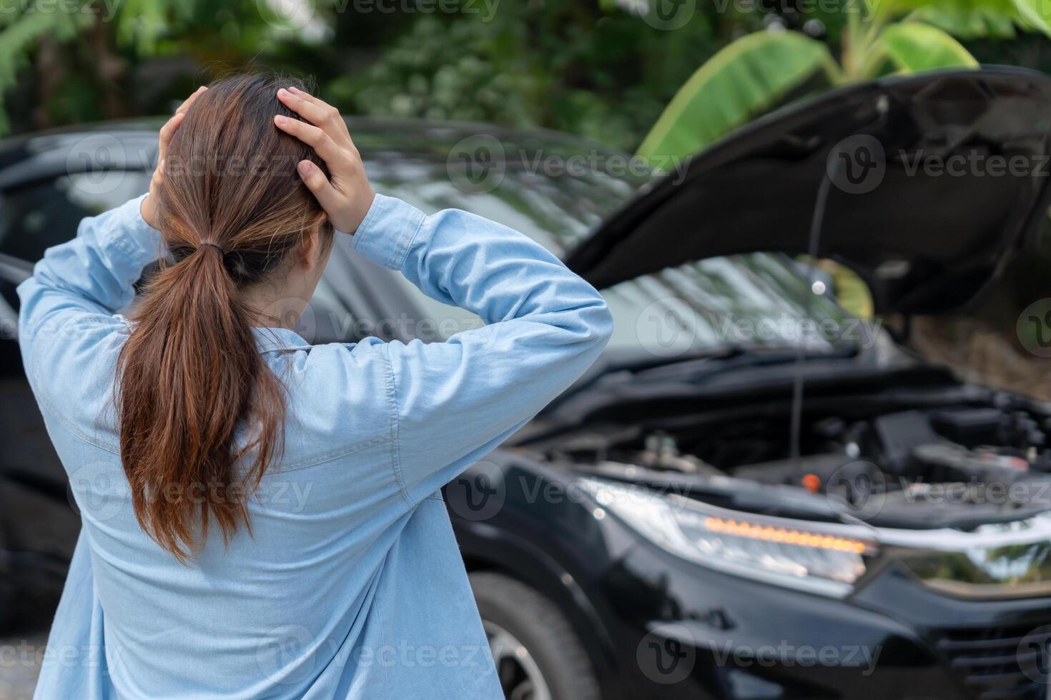 breakdown broken car, repair. Stress Woman look engine during car accident . Find garage to get car fixed during country tour, waiting for help, emergency. photo