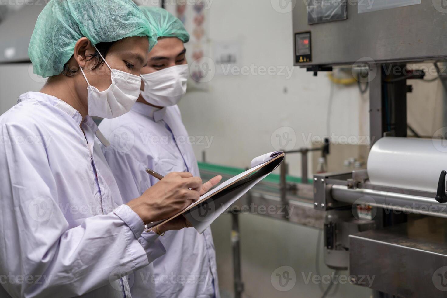 quality supervisor or food beverages technician inspection about condition control food or beverages before send product to the customer. Production leader recheck machine and productivity. photo