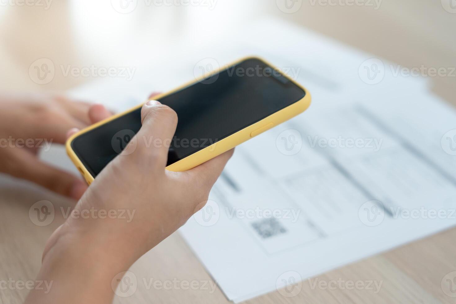 scan barcode or QR codes to pay credit card bill after receiving document invoice online. payment, receive, paying electricity, digital payments, technology, scanning, financial transactions photo
